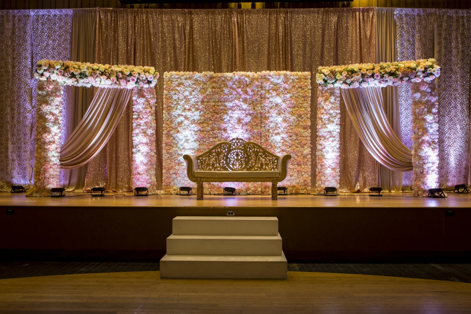Beautiful floral stage with glittering accents for Indian wedding reception