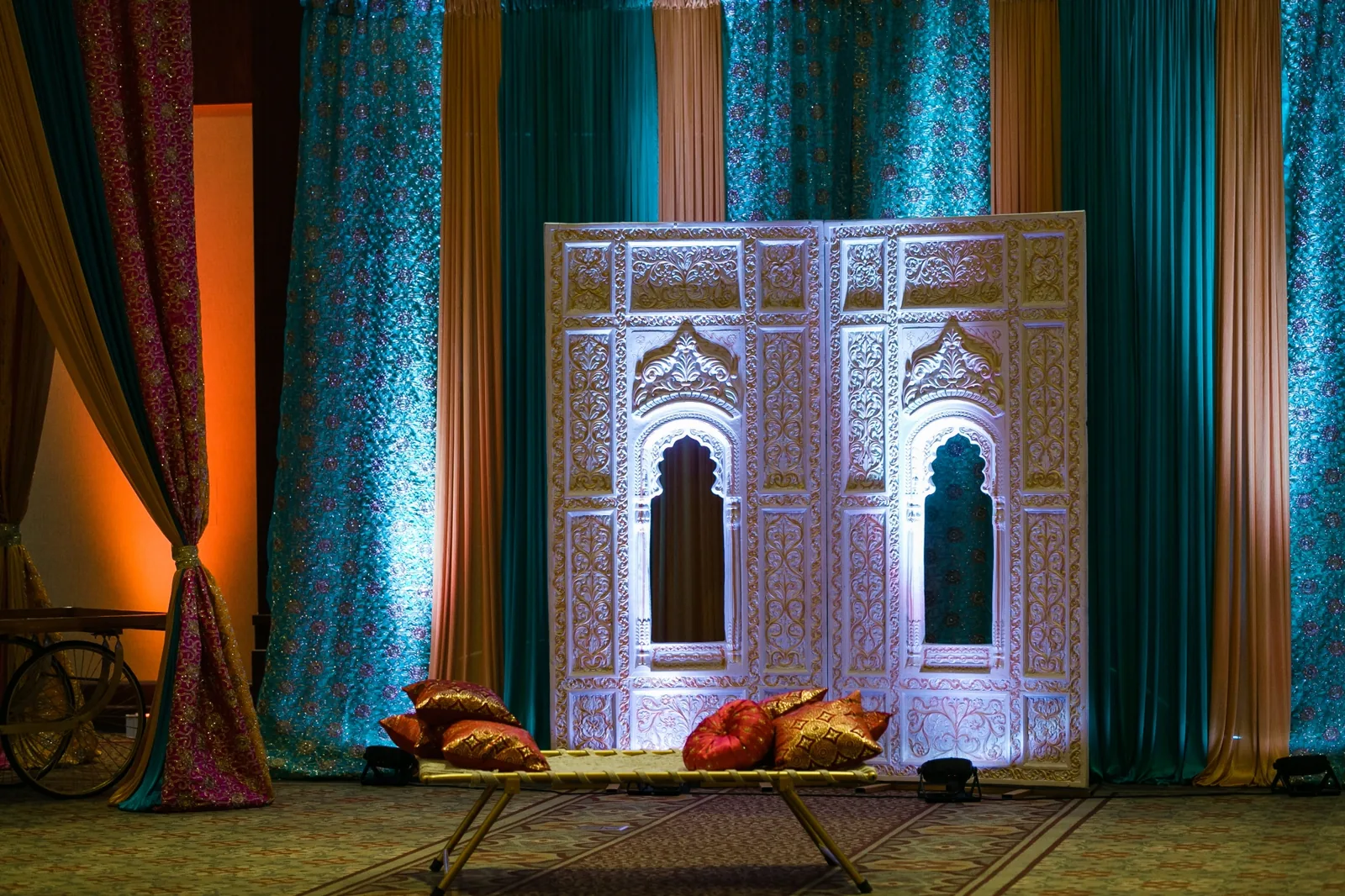 Draped canopy with elegant props for Indian sangeet event