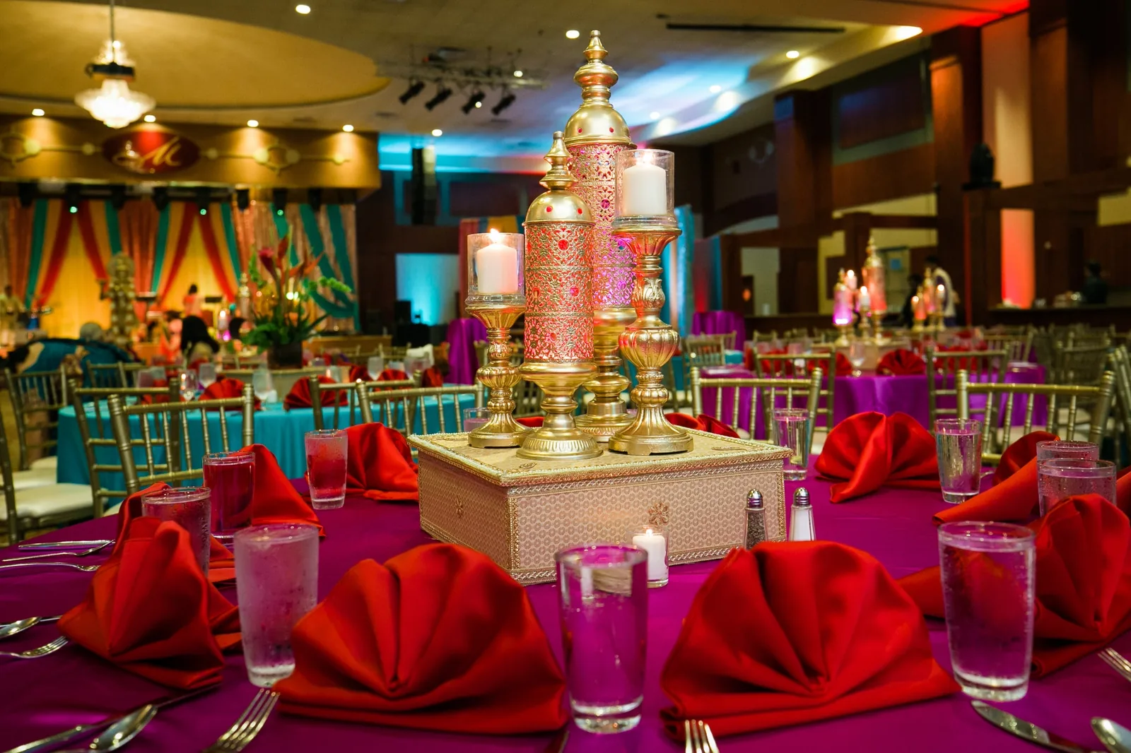 Vibrant colorful centerpieces at Indian sangeet event