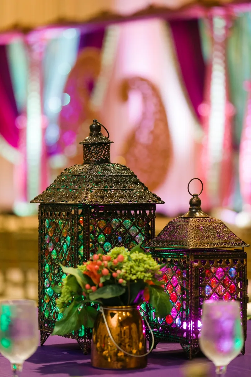 Deep jewel-tone centerpieces at Indian sangeet celebration