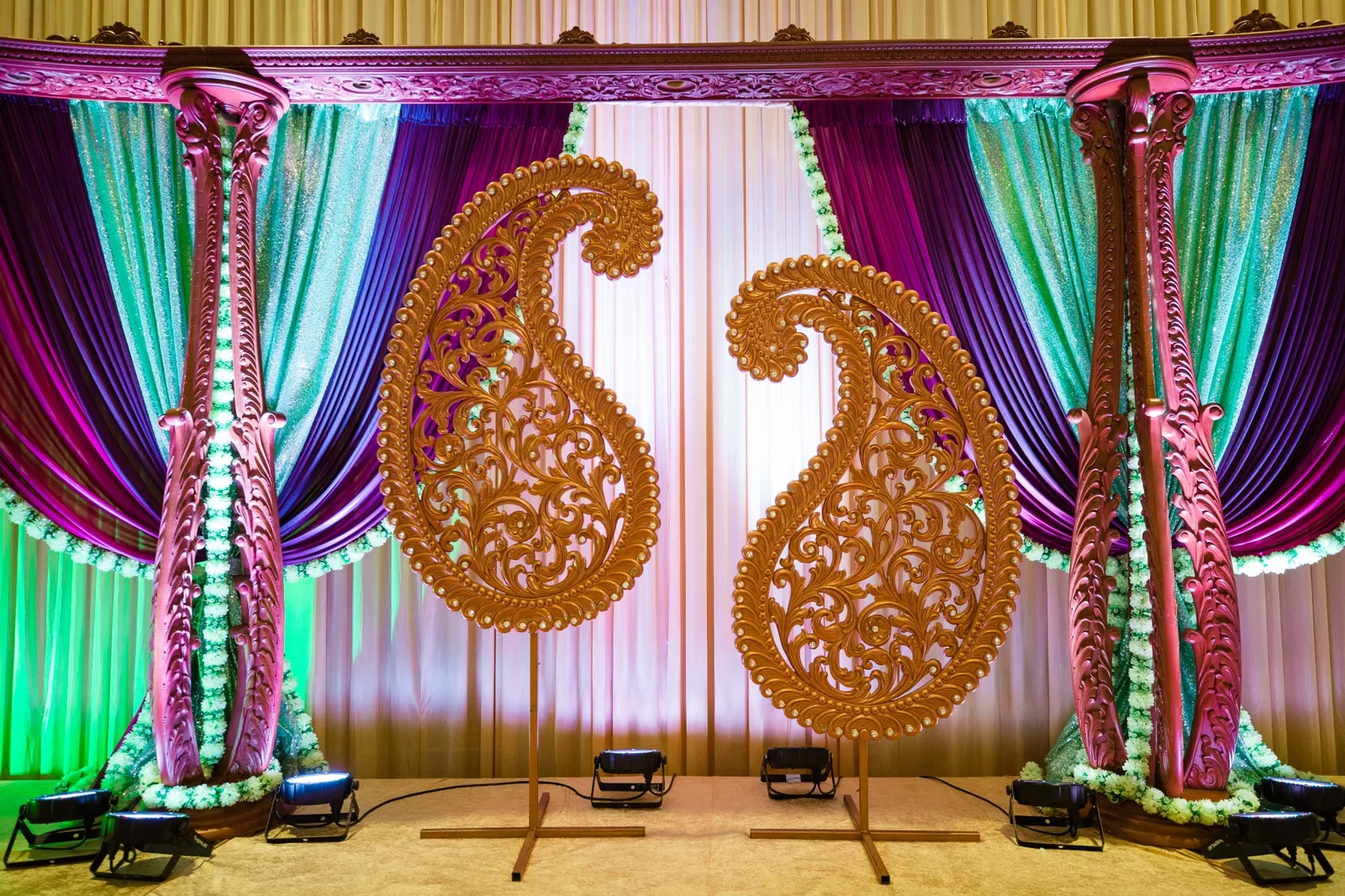 Jewel-tone color palette decor for Indian wedding celebration by Poonam Creations