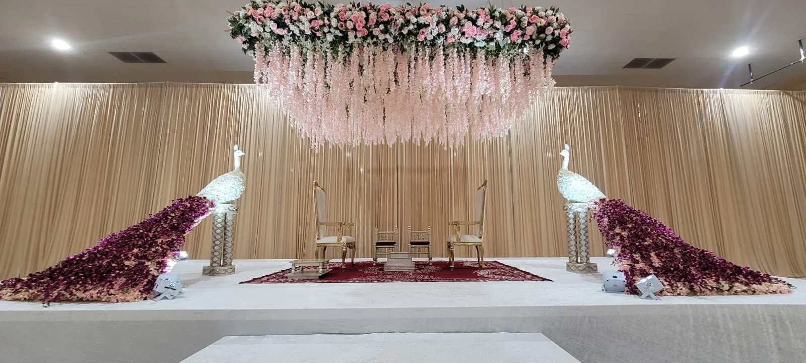 Peacock-themed stage backdrop for Indian wedding ceremony, Poonam Creations Chicagoland