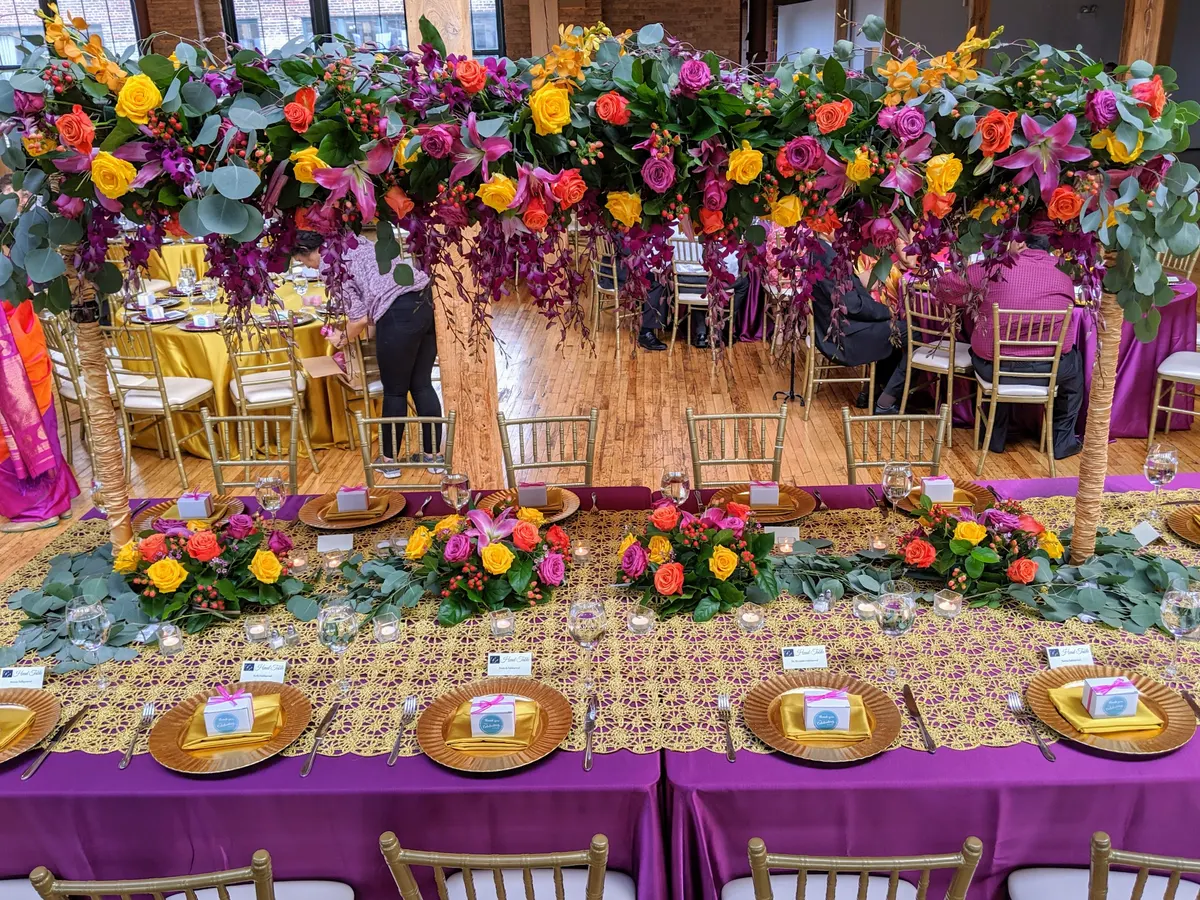 Lush floral reception decor for Indian wedding by Poonam Creations, Chicagoland